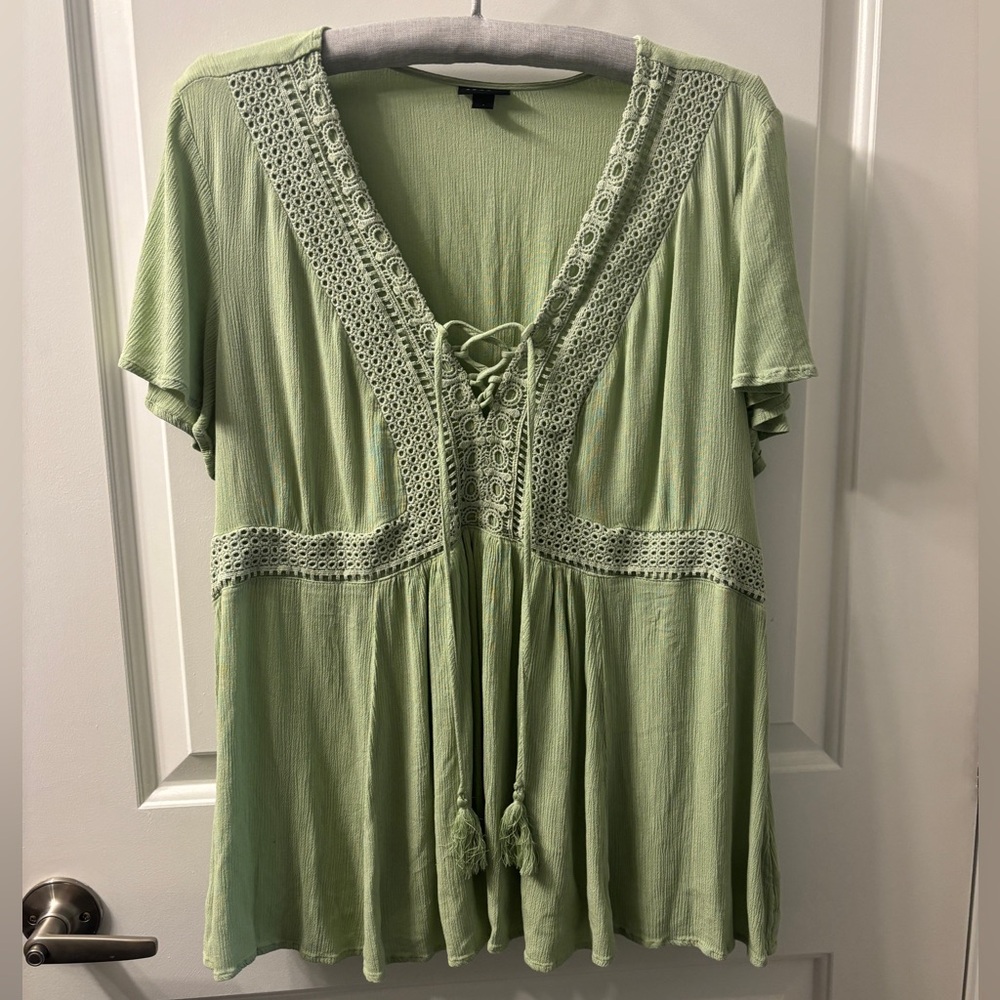Green blouse with decorative detail